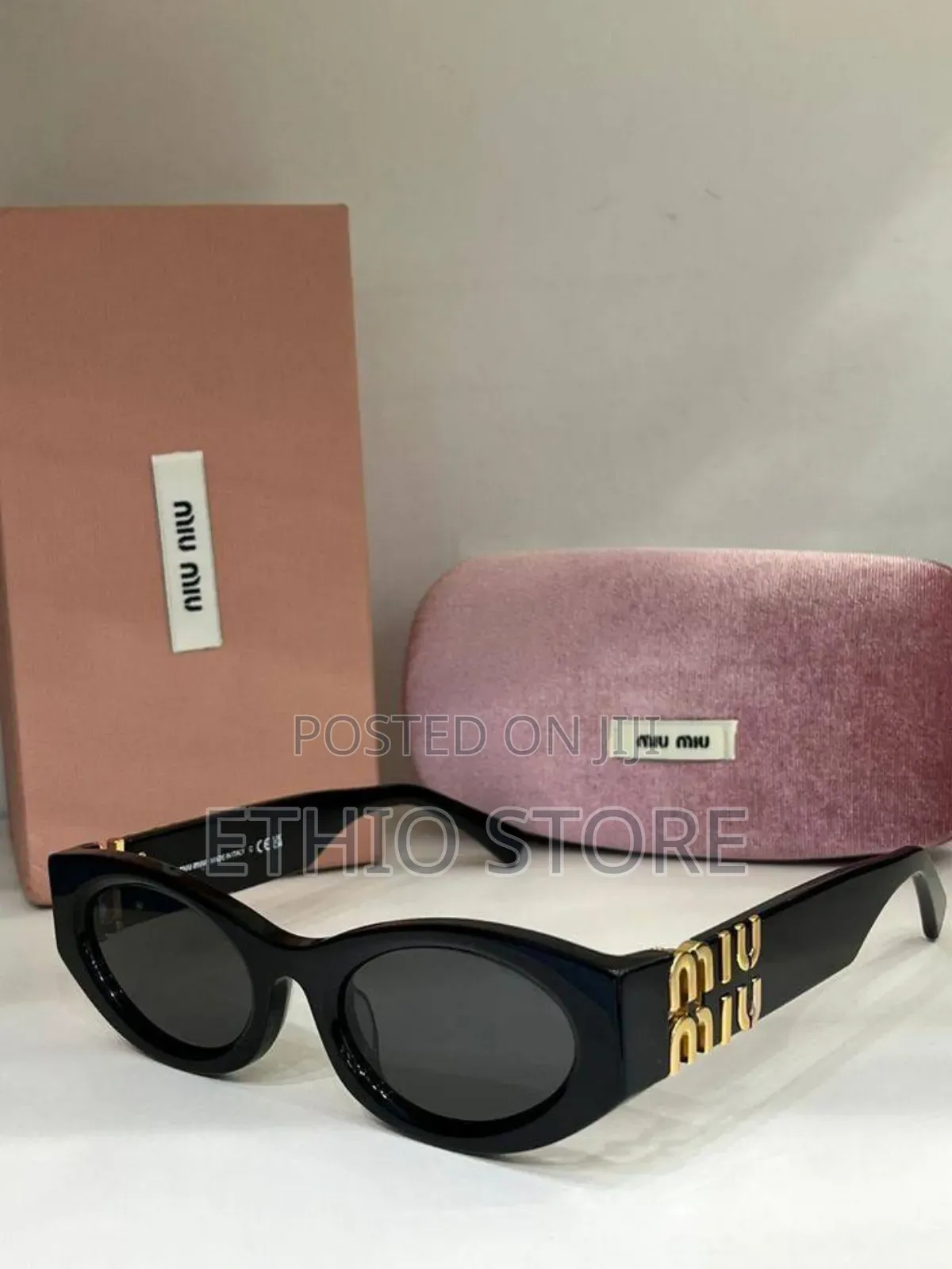 Miu Miu Sunglass in Black