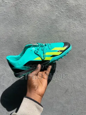 Photo - Football Shoes,ታኬታ