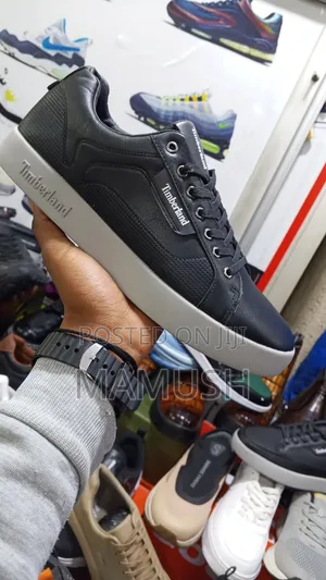 This Is Apaire of Timberland Sneakers With Amulticoloerd Shoes