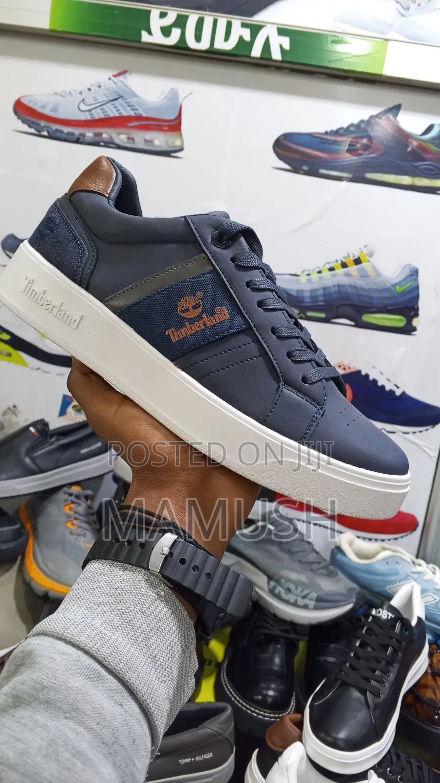 This Is Apaire of Timberland Sneakers With Amulticoloerd Shoes