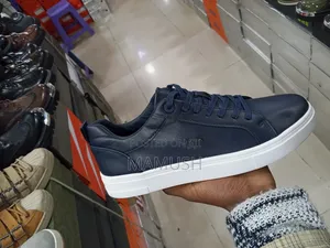 This Paire of Boos Sneakers in Amulticolord