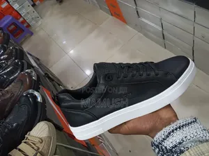 This Paire of Boos Sneakers in Amulticolord