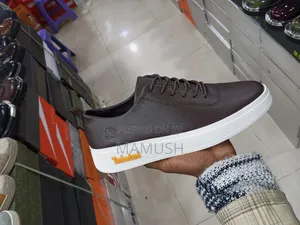 This Paire of Boos Sneakers in Amulticolord