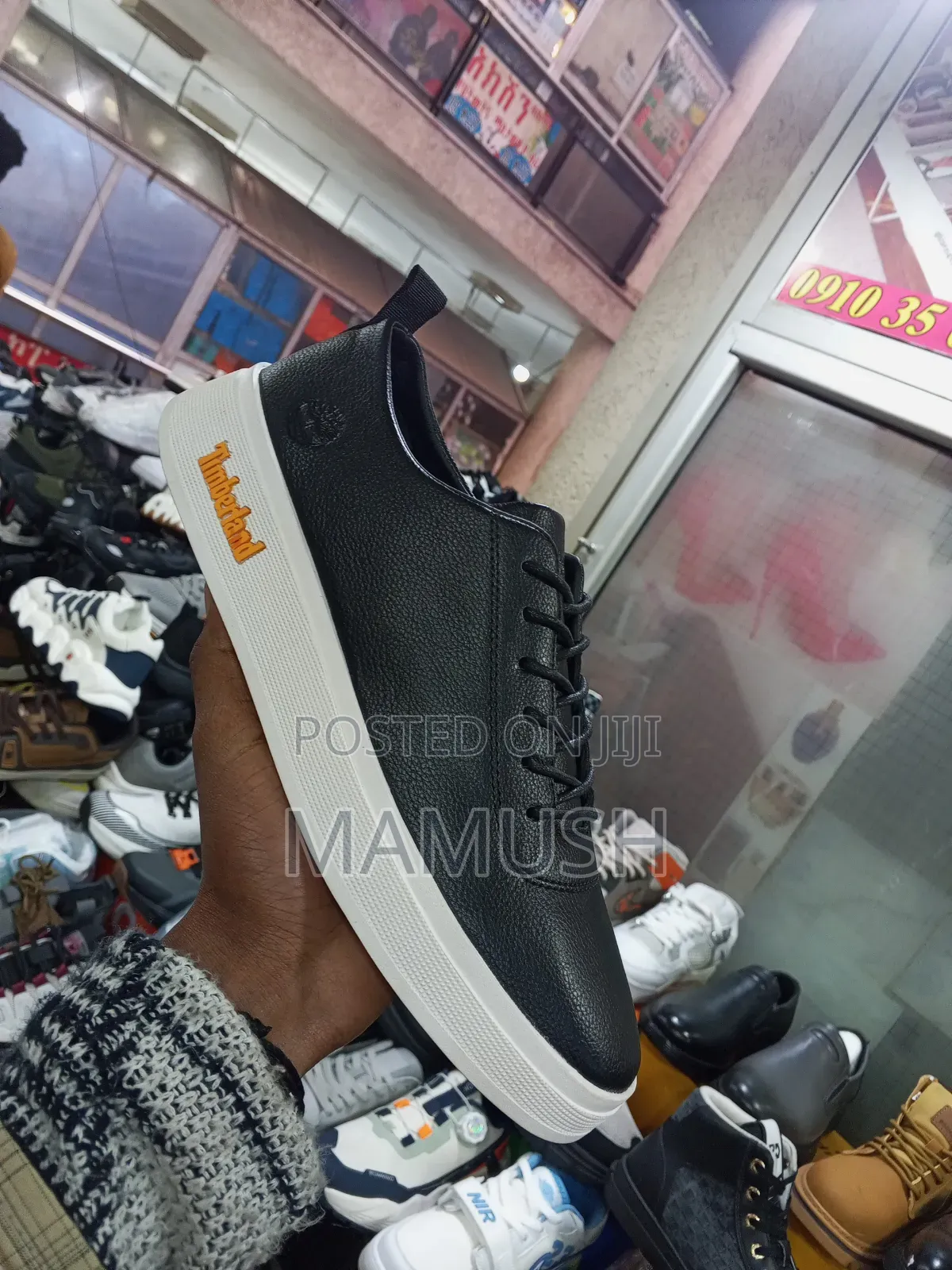 This Paire of Boos Sneakers in Amulticolord