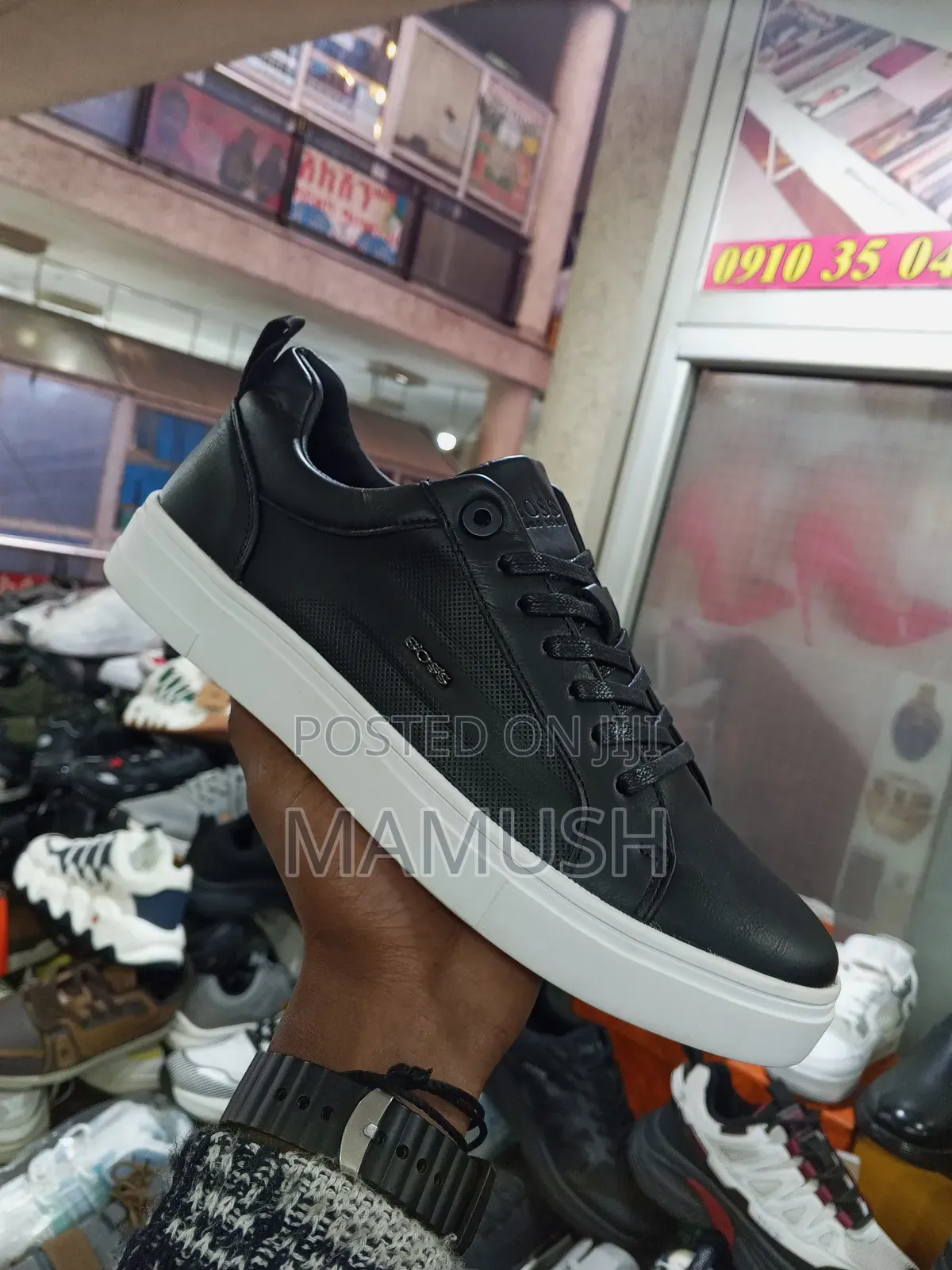 This Paire of Boos Sneakers in Amulticolord