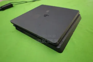 Photo - Ps4 Slim Console