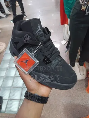 Photo - The Air Jordan 4 Retro "Black Cat