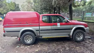 Photo - Mitsubishi L200 2001 Red