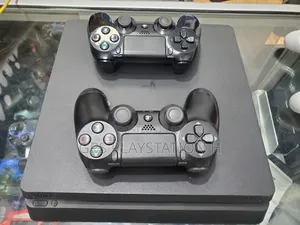 Photo - Playstation 4 Slim Jealbreak Ps4 Dubai Used More Than 10 Games