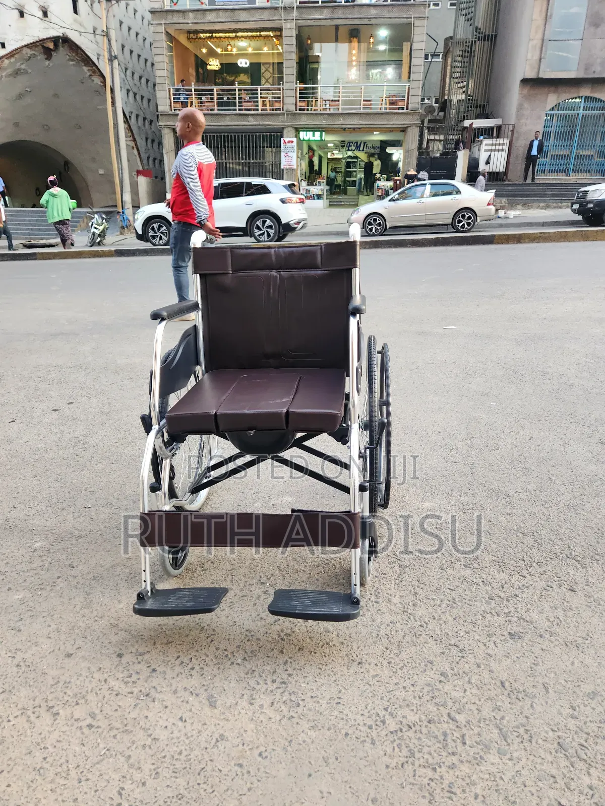 ዊልቸር Wheelchair a Throne of Grit and Grace on the Unpaved Way of Road