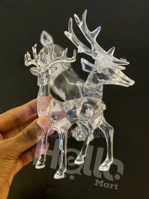 Two Clear Acrylic Reindeer Figurines.