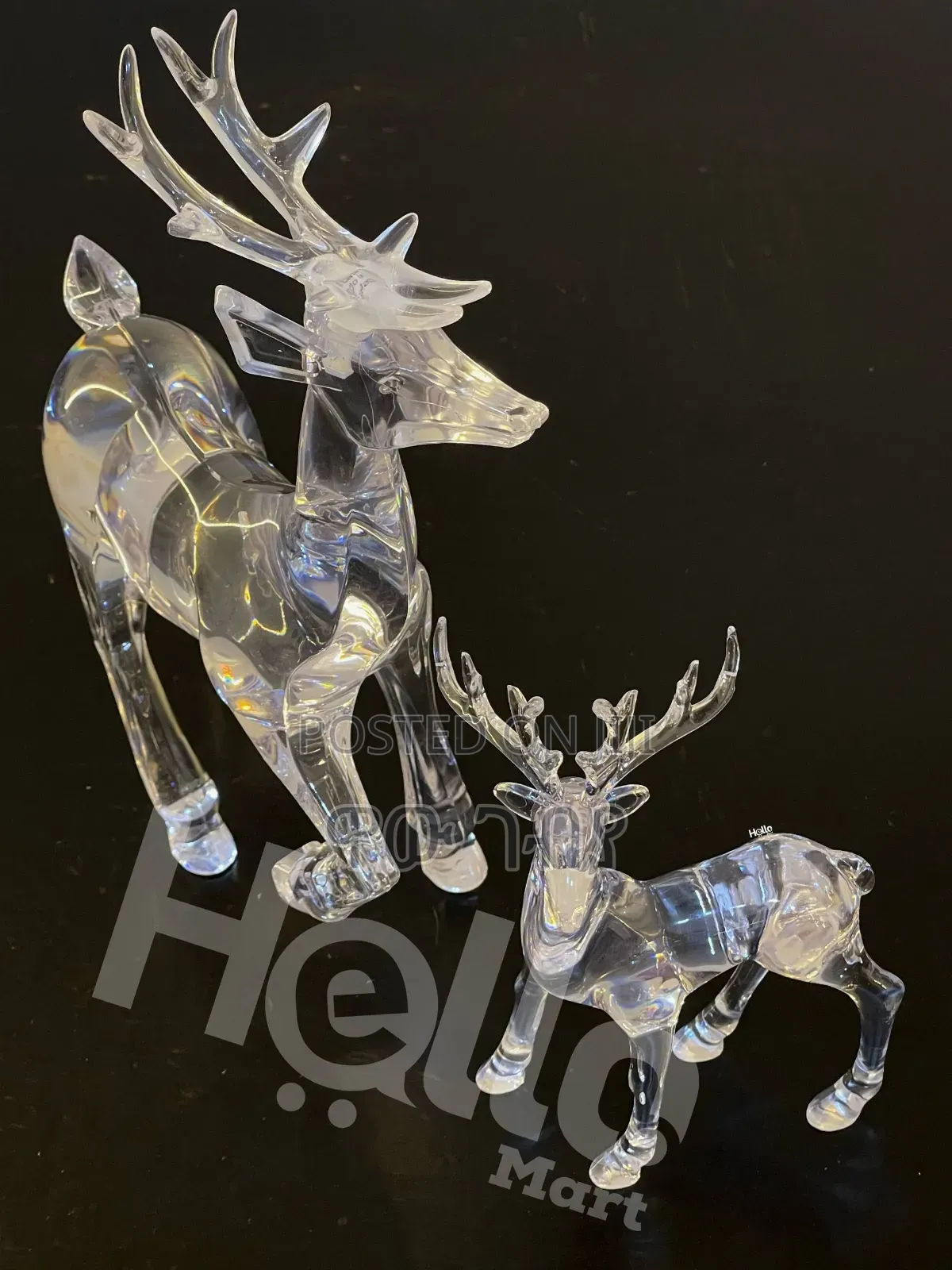 Two Clear Acrylic Reindeer Figurines.