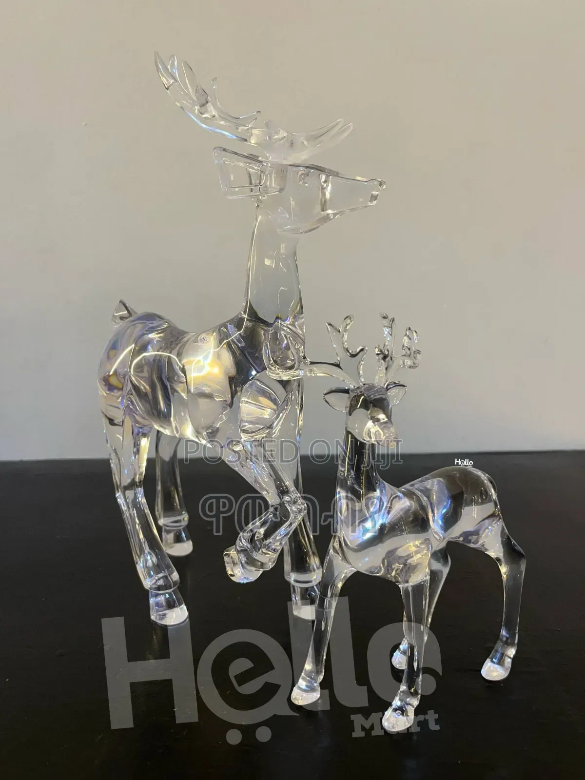 Two Clear Acrylic Reindeer Figurines.
