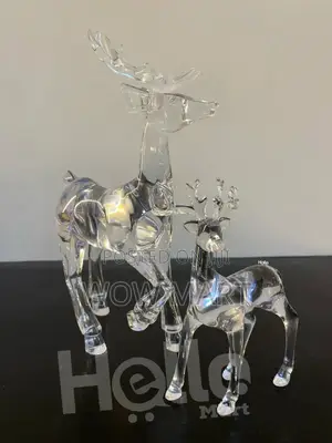 Two Clear Acrylic Reindeer Figurines.