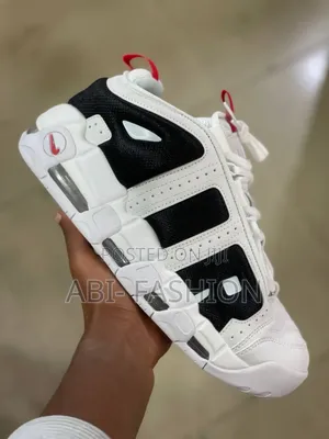 Nike Air More Uptempo Low Sneaker in the White Photon Dust" Colorway.