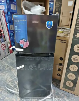 Midea Top-Mount Refrigerator, Likely Model 187l or Similar, in Black.