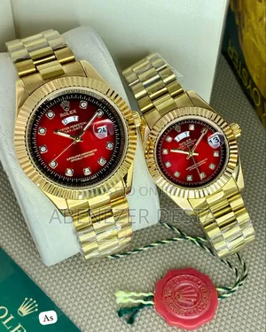Gold-Toned Rolex Day-Date Style Watches With Red Dials and Diamond Hou