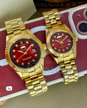 Gold-Toned Rolex Day-Date Style Watches With Red Dials and Diamond Hou