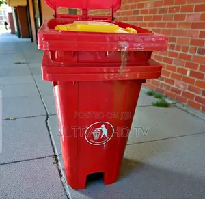 Red Plastic Outdoor Garbage Bin, Likely Around 100 Liters in Capacity,