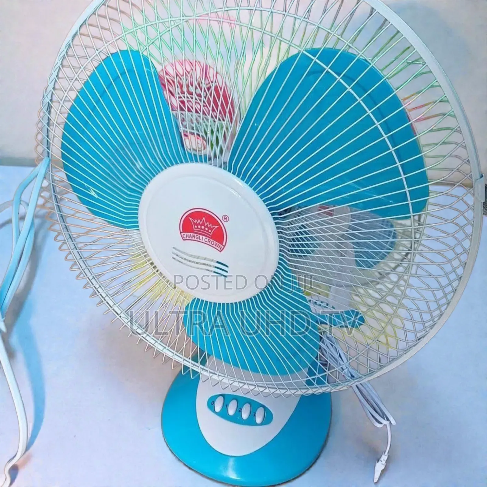 Changli Crown Table Fan It Has a Blue and White Plastic
