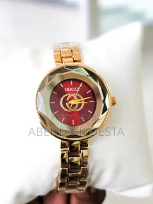 Gold-Tone Watch With a Red Dial and Faceted Crystal, Possibly a Gucci