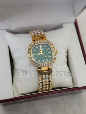 Gold-Plated Zircon Wrist Watch With a Green Dial.