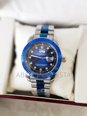 Rolex Day-Date Watch With a Blue and Silver Two-Tone Design and Diamon