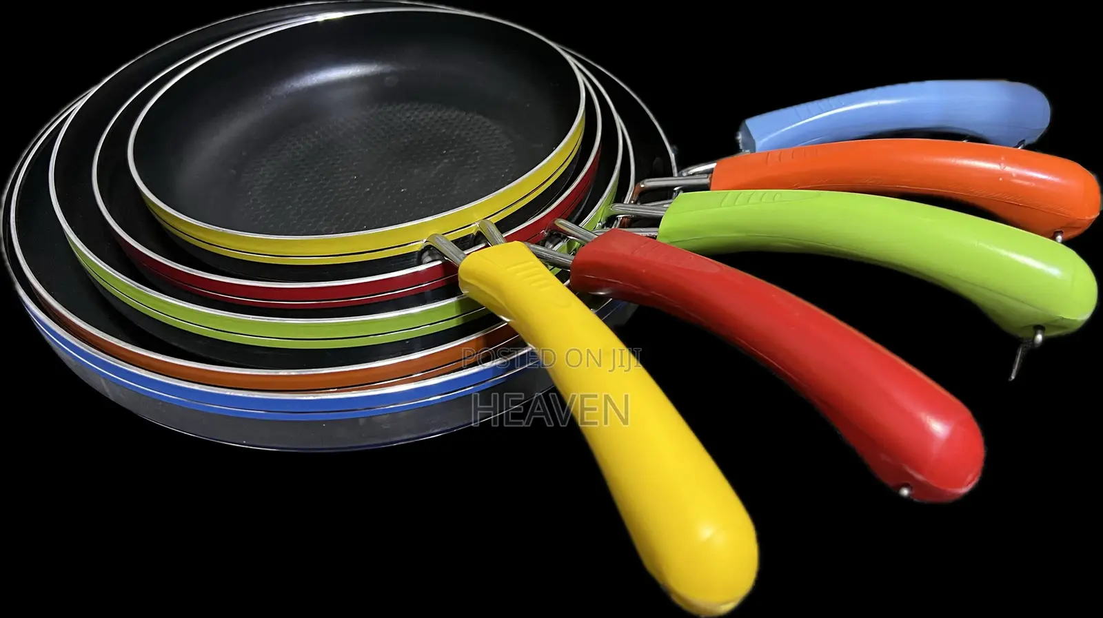 Five Nonstick Frying Pans With Colorful Handles.