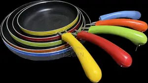 Five Nonstick Frying Pans With Colorful Handles.