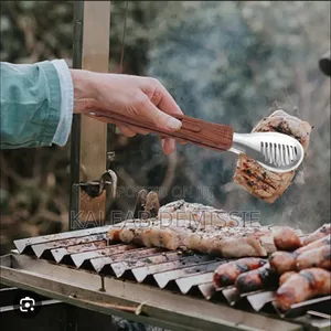መቆንጠጫ ወይም ምግብ ማንሻ Stainless Steel Food Tongs With Wood Grain Handle