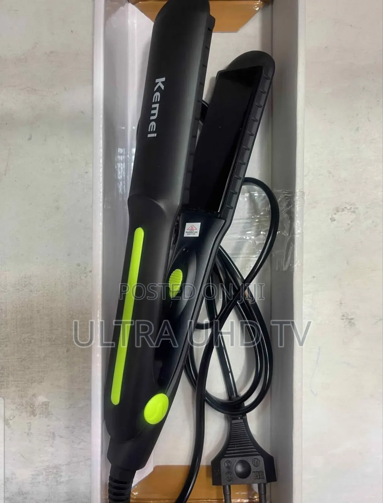 Kemei Km-2118 Hair Straightener. It Features Ceramic Plates.