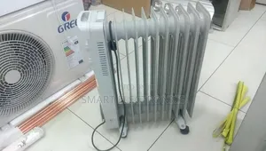 Nikura 9-Fin Oil Heater. It Features Three Power Settings And