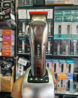 Kemei Km-9360 Electric Hair Clipper With an LCD Display.