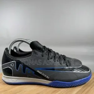 The Nike Air Zoom Mercurial Vapor 15 Academy Ic Indoor Soccer Shoe.