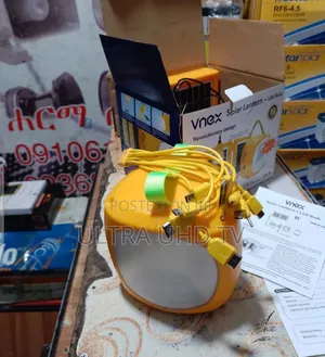 Solar Vnex Lantern With an Integrated Led Light and a Yellow Body.