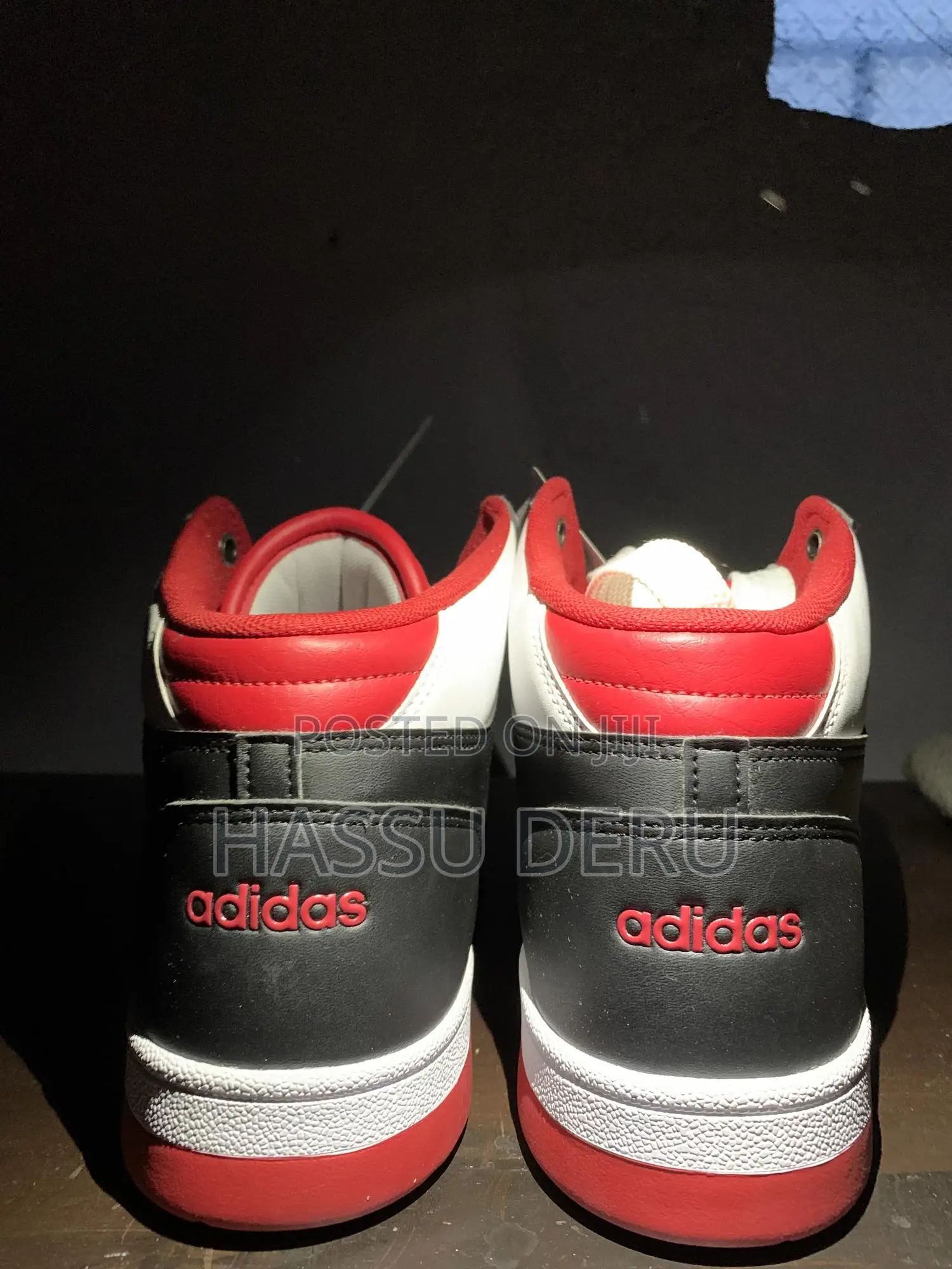 Adidas Rapid Court Mid Sneakers in a Black, White, and Red Colorway.