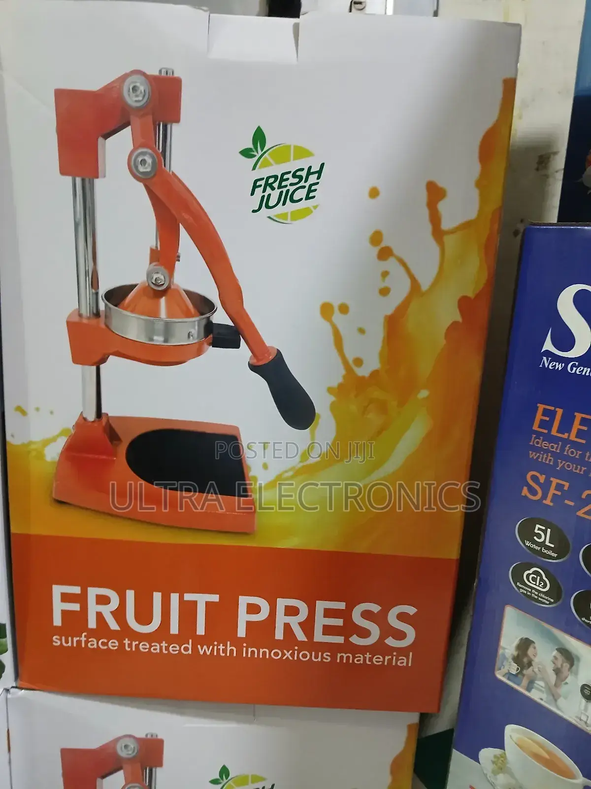 Manual Citrus Juicer Featuring a Lever Pressing Fruits Like Oranges,