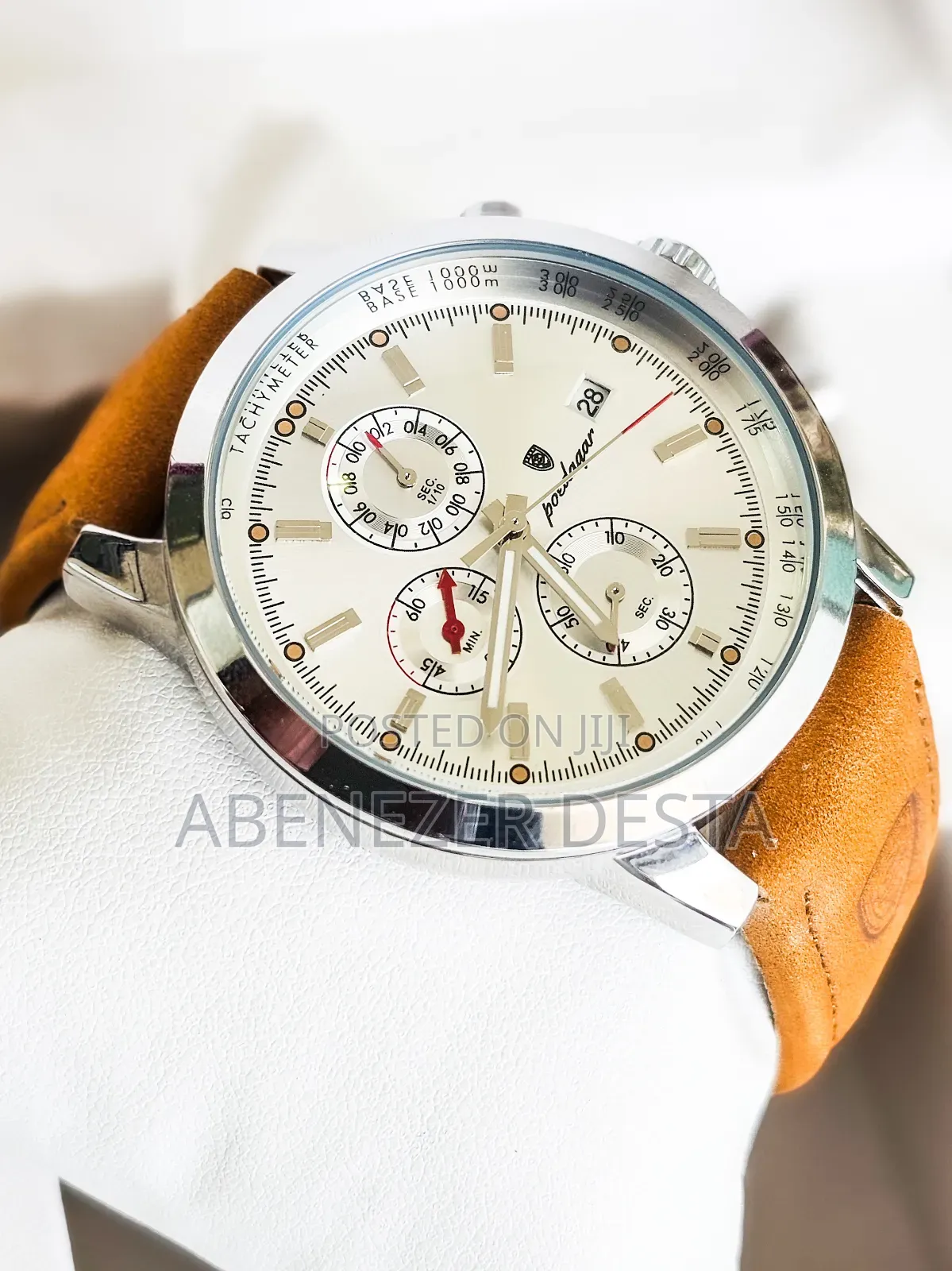 Luxury Wristwatch Features a Leather Band and a Stainless Steel Case