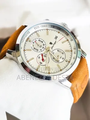 Luxury Wristwatch Features a Leather Band and a Stainless Steel Case