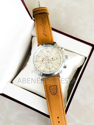 Luxury Wristwatch Features a Leather Band and a Stainless Steel Case