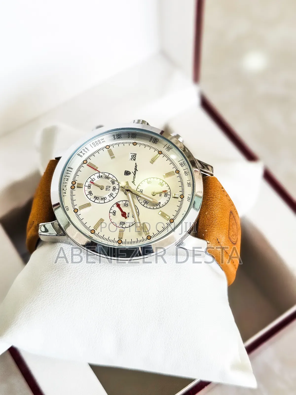 Luxury Wristwatch Features a Leather Band and a Stainless Steel Case