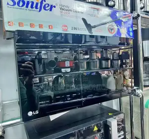 Lg Neochef Microwave Oven Displayed on a Shelf in a Store.