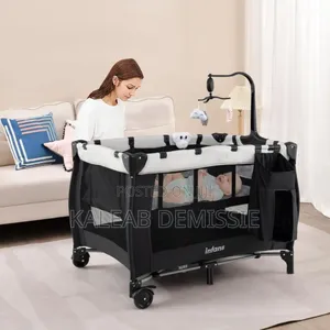 የልጆች ማሰተኛ እና ማዋያ የራሱ አጎበር ያለዉ Bedside Crib