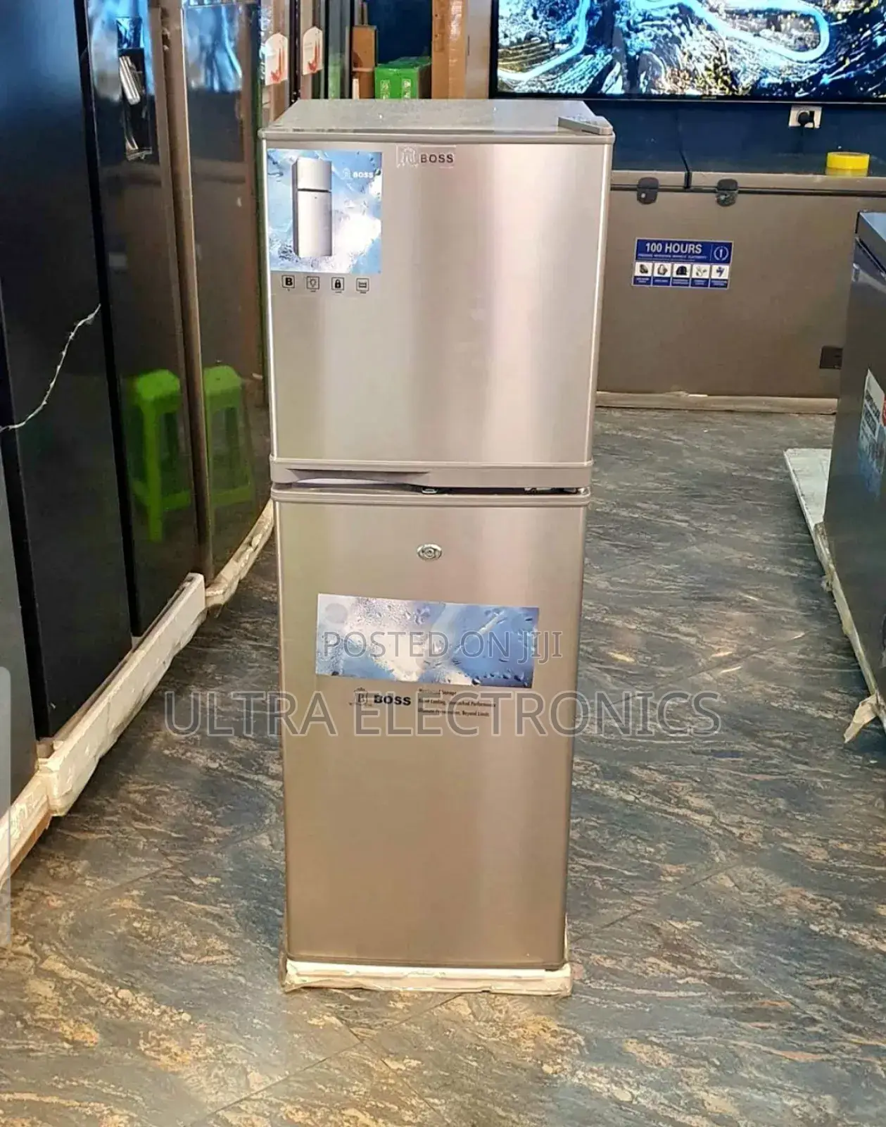 Boss 250 Model Refrigerator. It Is A Silver-colored, Double-door