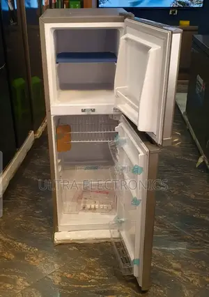Boss 250 Model Refrigerator. It Is A Silver-colored, Double-door