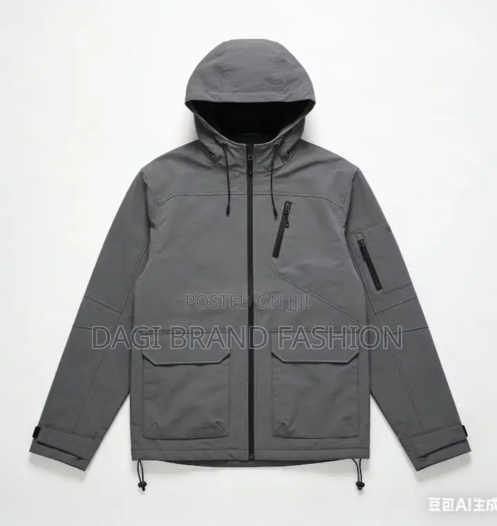 The Main Body of the Jacket Is a Muted Grey or Light Green Color.