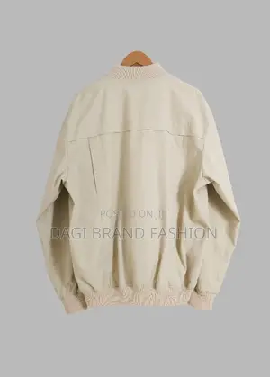 Based On The Visual Style, This Item Is A Beige Bomber Jacket