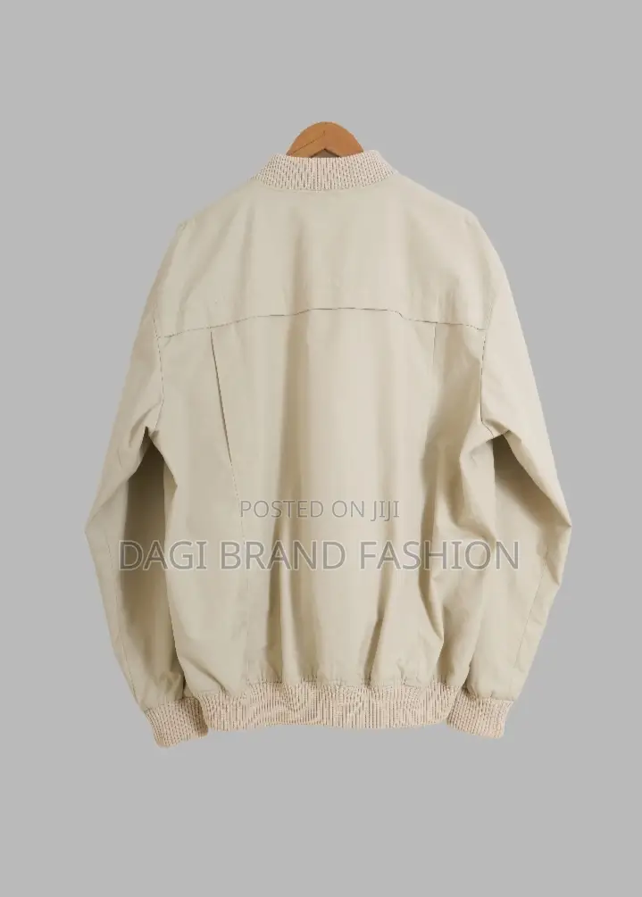 Based On The Visual Style, This Item Is A Beige Bomber Jacket