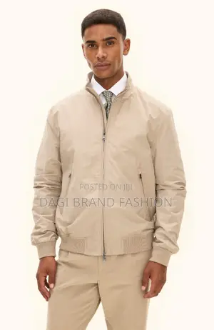 Based On The Visual Style, This Item Is A Beige Bomber Jacket