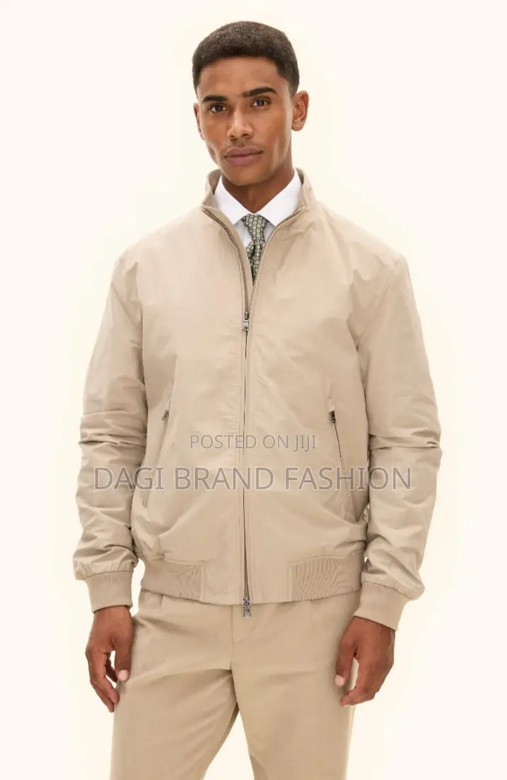 Based On The Visual Style, This Item Is A Beige Bomber Jacket